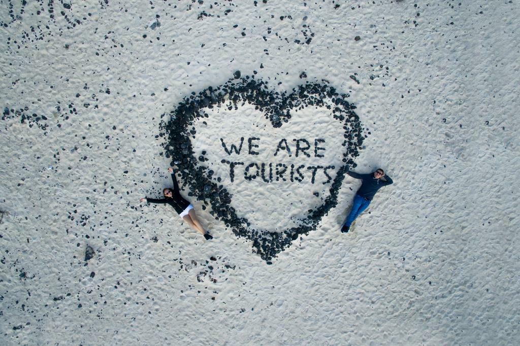 "We Are Tourists" Written in Stones on a Beach | Aerial Drone Photography | Romantic Travel Poster - Photography Poster