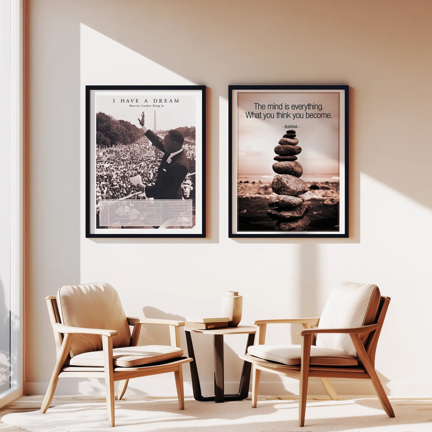 Two framed posters on a wall above two chairs in a room.