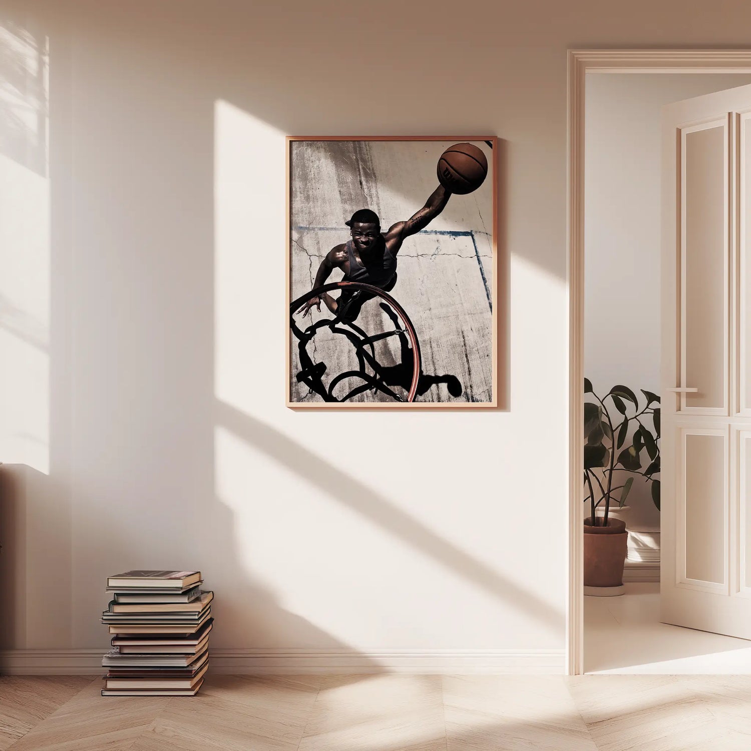 Framed artwork of a basketball player in action on a wall in a well-lit room.