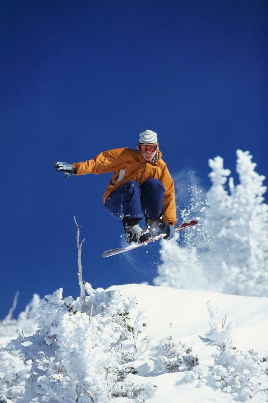 Woman Freestyle Snowboarding Mid-Air | Winter Sports Photography | Action Poster - Sports Poster