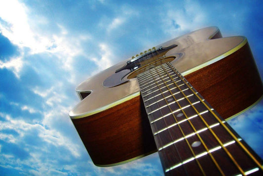 Acoustic Guitar Against a Blue Sky | Low Angle Photography | Music Art Poster - Photography Poster