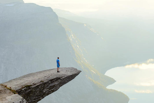 Hiker on Trolltunga Cliff Poster | Norway Adventure Photography | Scenic Landscape Wall Art