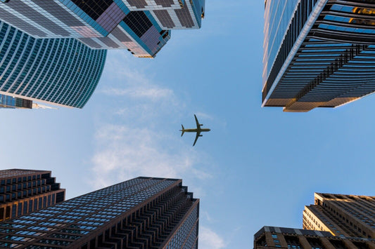 Airplane Flying Between Skyscrapers | Urban Perspective Poster | Cityscape Aviation Wall Art - Cars Poster