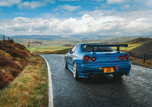 Nissan Skyline GT-R R34 Driving | Bayside Blue JDM Legend Poster | Scenic Mountain Road Photography - Cars Poster