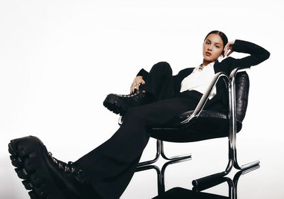 Olivia Rodrigo Black Suit & Boots | Sitting in Chair Photo | Pop Music Poster - Music Poster