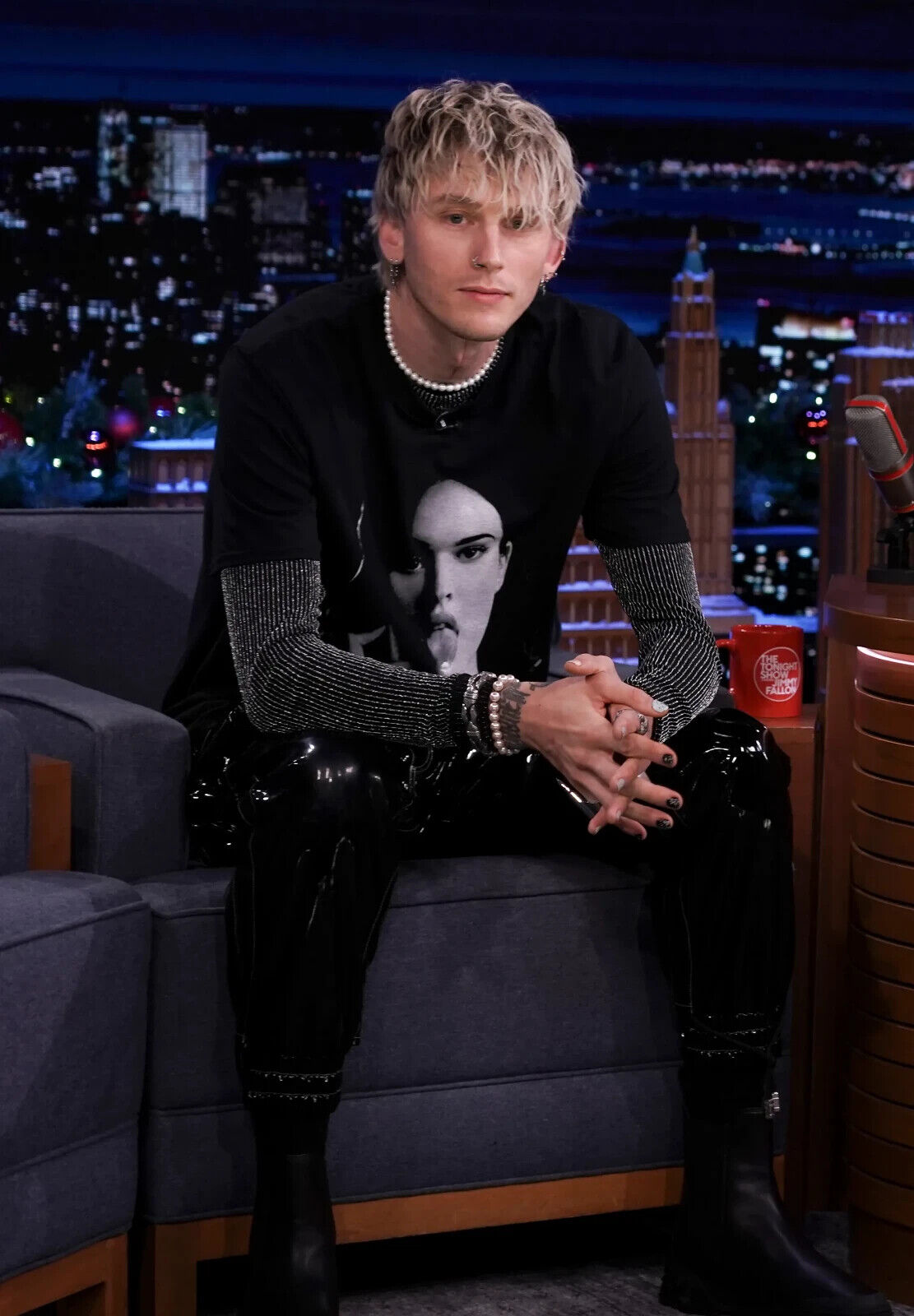 Machine Gun Kelly Sitting on Couch | Black Graphic Tee & Vinyl Pants | Music Interview Poster - Music Poster