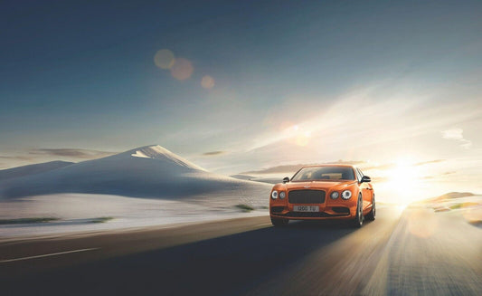 Bentley Flying Spur | Orange Luxury Sedan Poster | Grand Tourer on Desert Road at Sunrise - Cars Poster