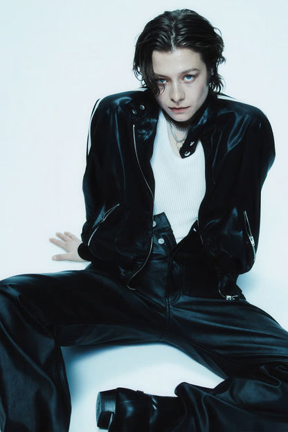 Emma D Arcy in Black Leather Suit Poster | Seated Wall Art Print - Celebrities Poster