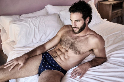 Male Model in Blue Briefs Poster | Laid-Back Bedroom Portrait - Photography Poster